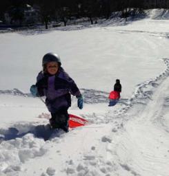 Walsh Park Coasting: Sprung from school, Madeleine (9) and Clare (6) Ablett enjoyed the thrill ride on the slopes of Clancy Road. Photo courtesy Ann Walsh